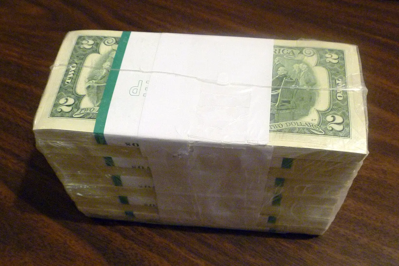 A shrink-wrapped brick of banknotes on a table